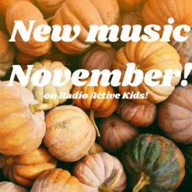Image description: an overhead shot of multicolored pumpkins. Overlaid on top of the pumpkins are the words "New music November! on Radio Active Kids" in white lettering.
