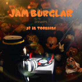 Image description: cover image for the album JB in Toonland by Jam Burglar, consisting of a figurine of the Hamburglar dj'ing at at a tiny turntable in front of an audience of figurines of cartoon characters including Mickey Mouse, Donkey Kong, and Tigger.