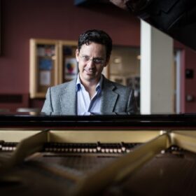 Bill Bares seated at the piano