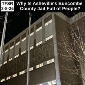 "TFSR 3-8-26 | Why Is Asheville's Buncombe County Jail Full of People?" featuring a photo from the New Years Eve 2021 Noise Demonstration at the jail with the words "Empty The Cages Free The People" projected on the outer walls of one wing